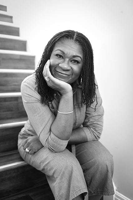 Lifestyle Portrait of a HR director casually posed in a staircase